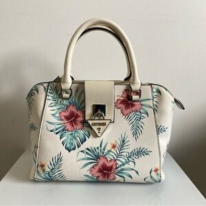 Floral pattern Guess purse with shoulder strap. Shows signs of use.  See photos